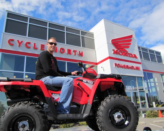 Brad Johnston sits on his new Polaris Sportsman 570EFI