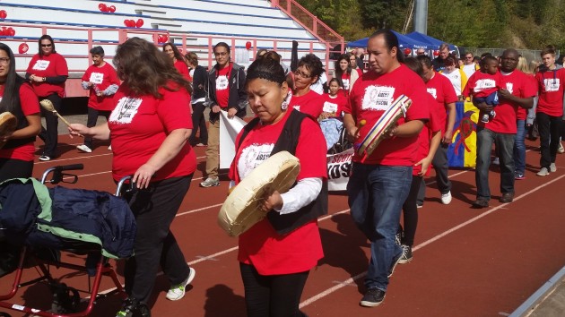 AIDS Walk participants circle the track at Masich Place Stadium - photo 250 News