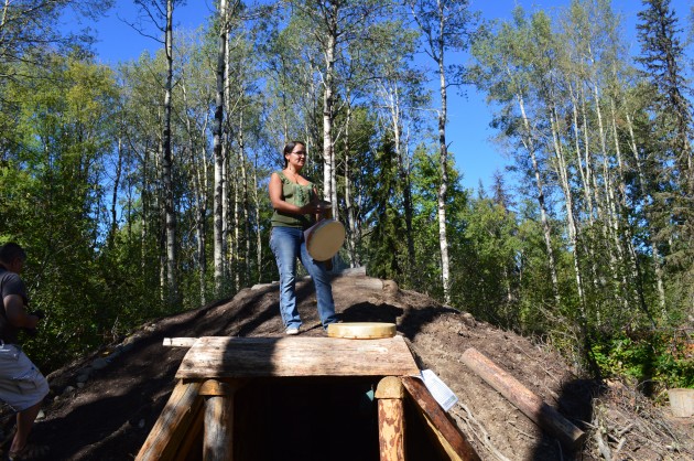 Jennifer Pighin address crowd from atop pit house. 250 News photo