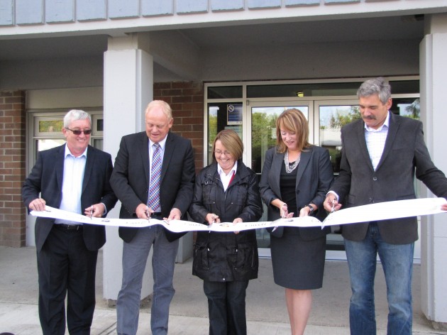 Malachi Tohill, MP Dick Harris, MLA Shirley Bond, Mayor Shari Green and MLA Mike Morris cut the ribbon outside the Victoria Towers - photo 250News
