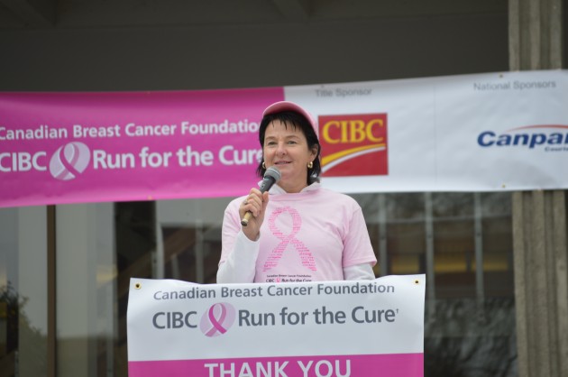 Survivor DebiLyn Smith stresses prevention and research. "Rock on Pink" she told crowd. Photos 250News