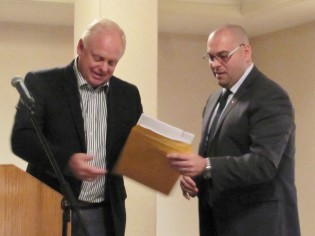 Dick Harris hands envelope of party memberships to Todd Doherty - photo 250 News