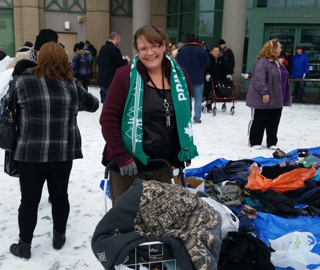 Michelle Rhodes collects donated clothing at Chili Blanket 12 - photo 250 News
