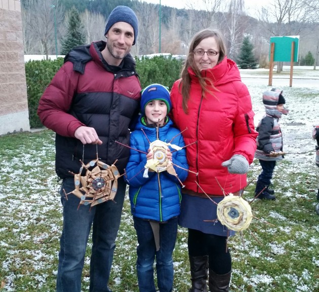 Dave, Meshach, and Chrystie Tarr celebrate the winter solstice at Fort George Park - photo 250News
