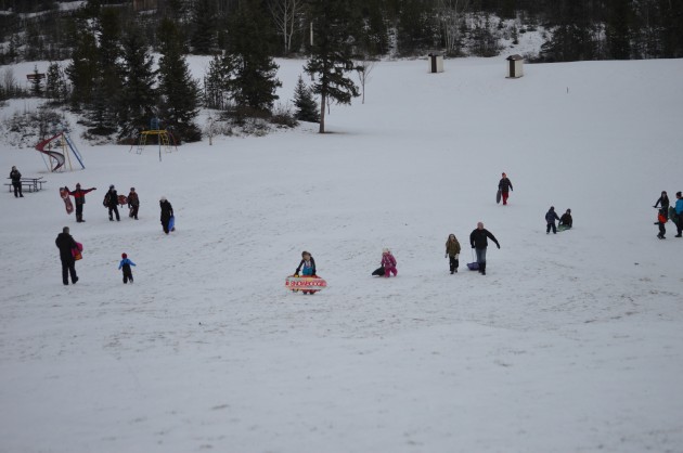 Rainbow Park was a favourite spot for sliding Saturday. 250News photos