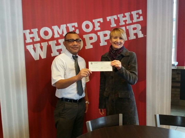 Burger King's Deepak Kumar presents cheque to Linda Parker of Community Policing - photo 250News