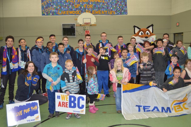 Team BC athletes join PG youngsters in group photo Saturday. Photos 250 News