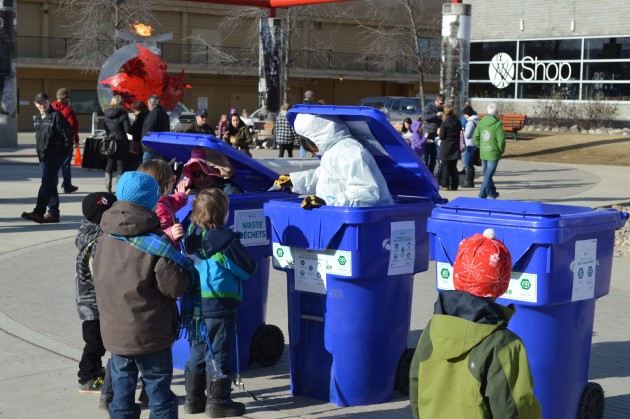 Put it in the right container, the message from pink-hatted Mike Peterson. Photo 250 News