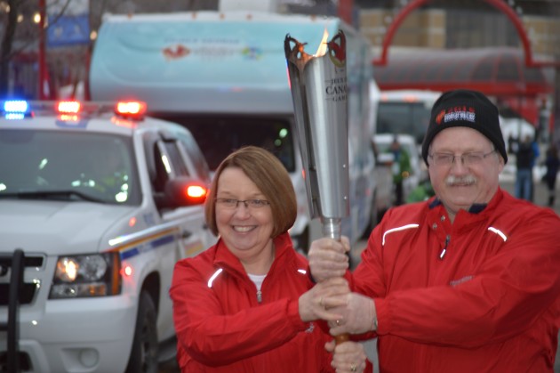 MLA Shirley Bond, husband Bill kick off final leg of Torch Relay through Prince George. Photos 250 News