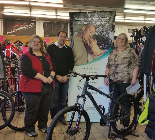 From left, CMHA volunteer Donna Clark, Shopper Drug Mart's Frank Lucarelli, CMHA executive director Maureen Davis - photo 250 News