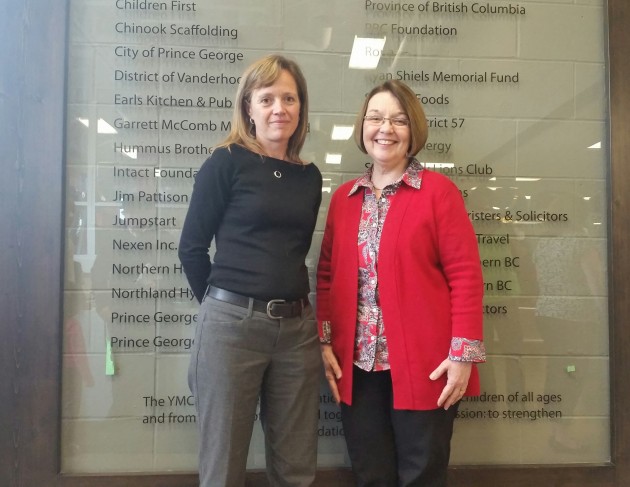 From left to right, YMCA of Northern BC CEO Amanda Alexander & Liberal MLA Shirley Bond stand in from the the Y's donor wall - photo 250 News