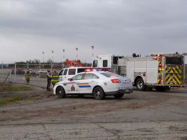 Police and city fire crews on standby at north end of YXS