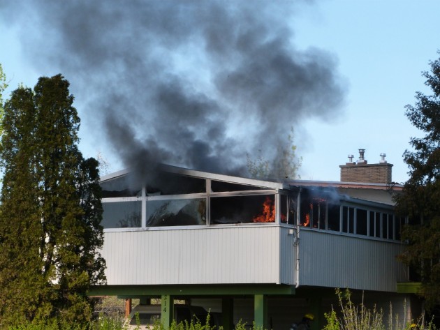 Smoke and flames were visible as firefighters arrived on scene. Photo 250News