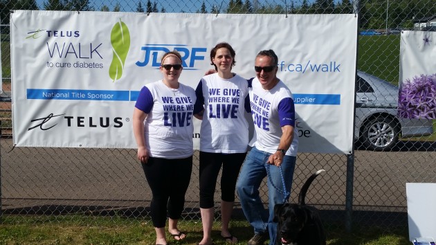 From left, Telus care representative Amanda Hollier, Telus Walk Chair Katie Katie Francis, Telus general manager for the Northern Interior Lance MacDonald and his dog Strider - photos 250 News