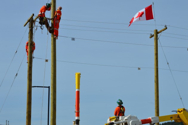 Apprentice PLT rescues "injured individual" from top of power pole during competition Saturday. Photo 250News