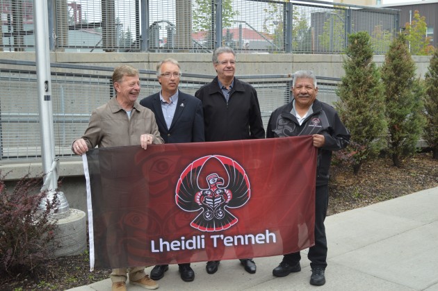 Councilor Krause, Minister Rustad, Mayor Hall and Chief Frederick hold Lheidli T'enneh flag. Photos 250News