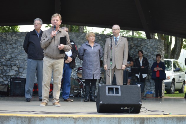 Councilor Murry Krause, with Council members, speaks of reconciliation