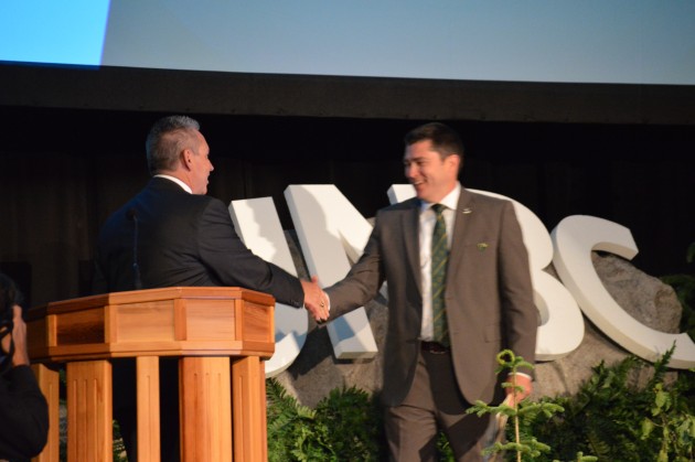 UNBC President Daniel Weeks congratulates new board chair Ryan Matheson on Saturday. Photo 250 News