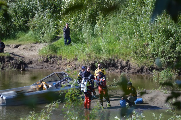 Diver leaves water following unsuccessful search of slough trench