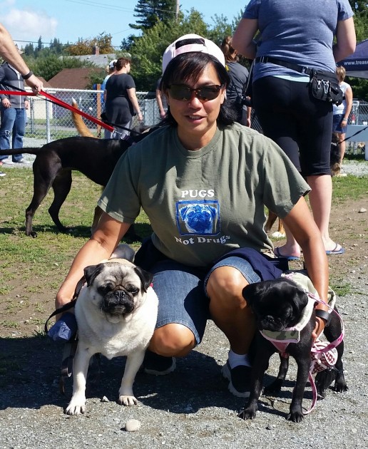 Kat Valcourt with her two pugs, from left Cujo, who won the "Golden Oldie" category and Kalese - photos 250 News