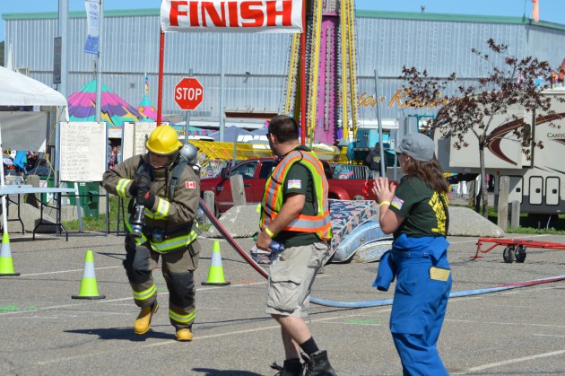 Hauling hose at the Firefighter Games, which resume at 10am