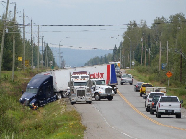 Semi-trailer blocks one lane of Highway 97 south Saturday morning. Photos 250News