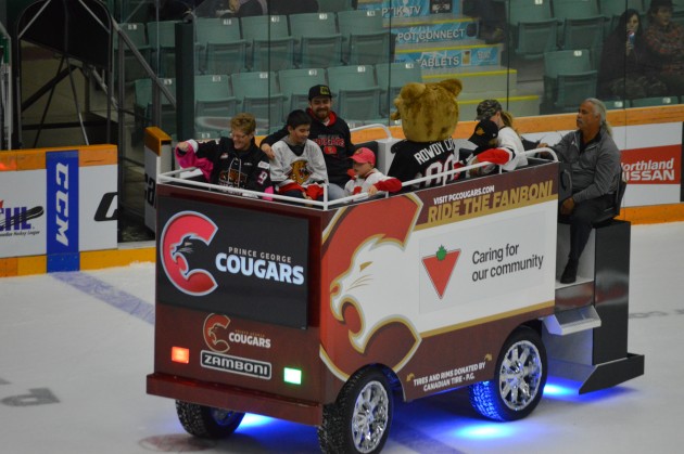 Fanboni takes lucky Cougars fans on ride around CN Centre during Cougars season opener Friday night. Photo 250News