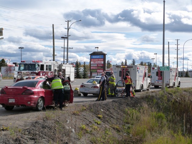 Emergency crews tend to occupants of two cars