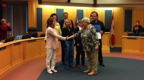 Enhance PG's Marlies Greulich presents the City's gardeners with award