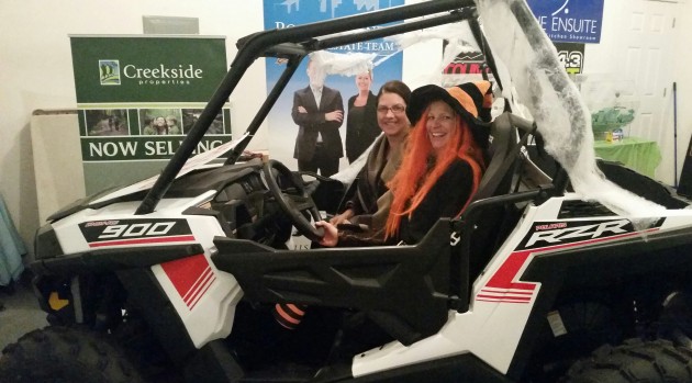 Colette Garneau (in the hat) and Deanna Watson model the 2015 Polaris Razor - photo 250News