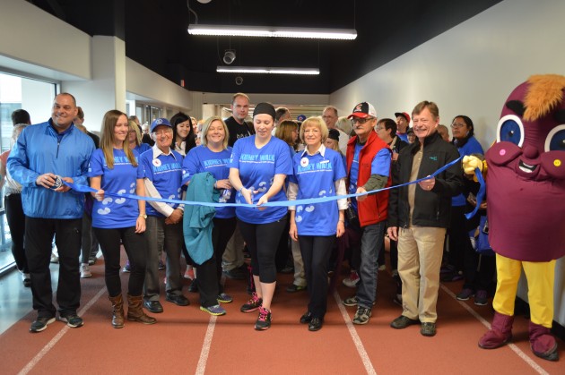 Tiana Peet cuts ribbon as friend Chiappe looks on at the start of the Prince George Kidney Walk Sunday. Photo 250 News