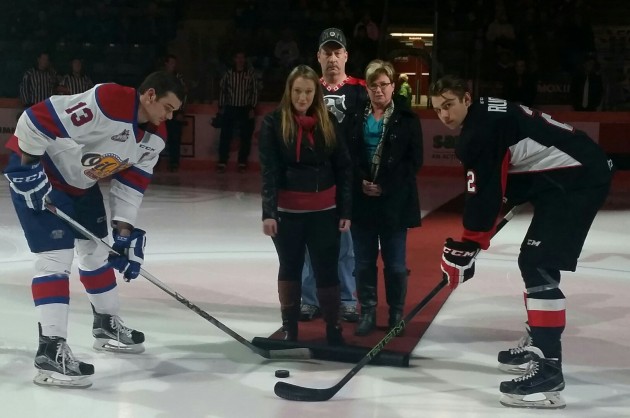 Delaney Tott drops the puck at last night's Cougars game - photos 250News