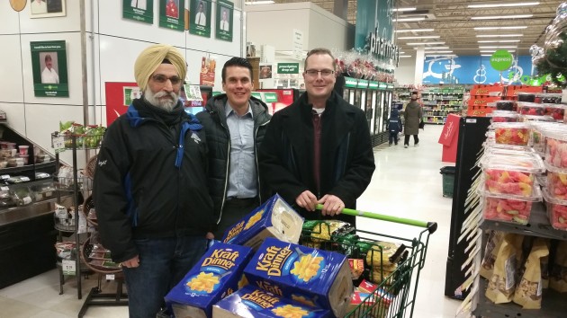 From left, Surjit Manhas, Scott McWalter of the Northern Sport Centre, and Shawn Stewart, who donated $1,000