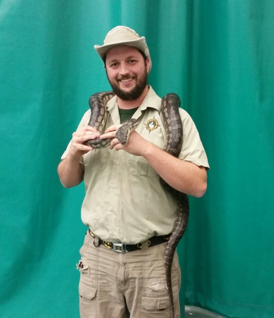Kyle Lawrie of Little Ray's Reptile Zoo holds a seven foot Coastal Carpet Python