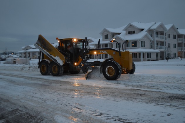 City and contract crews working through weekend to clear Friday snowfall. Photo 250 News
