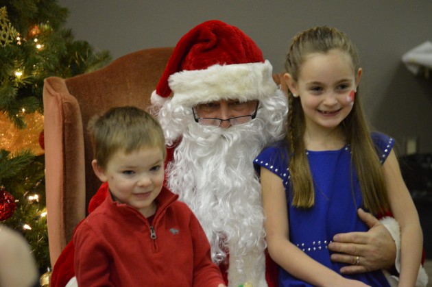 Kids get a big kick out of Santa at Sunday's breakfast in College Heights. Photos 250 News