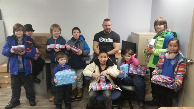 Reflex owner Riley Mueller hands out Christmas gifts - photos 250News