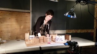 Designer and performer Eliza Houg prepares cardboard scale model of downtown Prince George