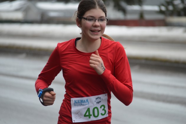 Smiling competitor on Foothills, heading to the Ice Oval