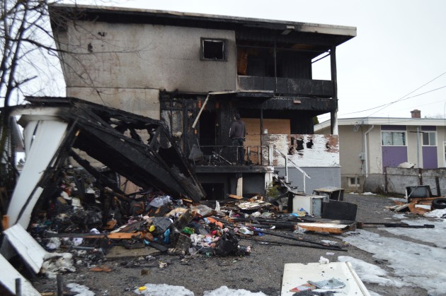 There is very little left of a garage (l) behind a rental property on South Kelly Street. Photo 250 News