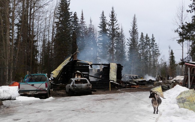 Smouldering remains of log home on Clearview Road 250News photo