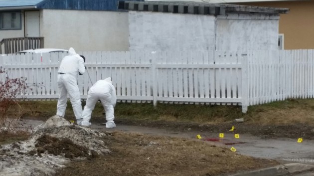 Investigators comb back alley