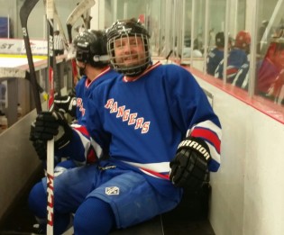 Chris Sacher shows off his Rangers uniform