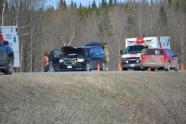 Damaged van rests in westbound lane of Highway 16