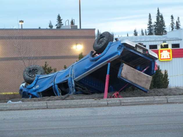 Pick-up came to rest on its roof following rollover at Highway 97 and Austin Road. Photos 250 News