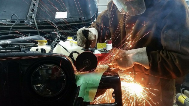 Rover Stan working on his jeep Eightball