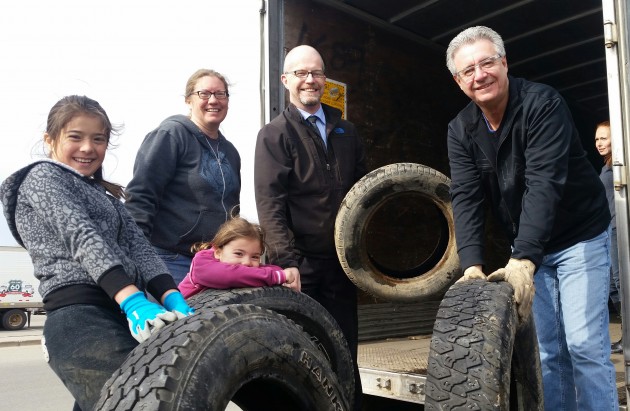 Prince George Mayor Lyn Hall, Councillor Garth Frizzell and students and PAC members at Polaris Montessori Elementary help recycle tires - photos 250News