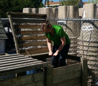 Christine Reid, environmental educator, hard at work in the Compost Demonstration Garden - photo 250News