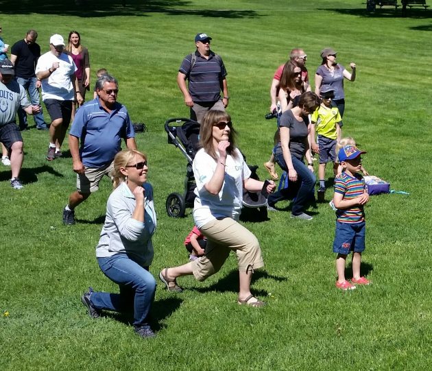 Dozens participated in a stretching session prior to the walk
