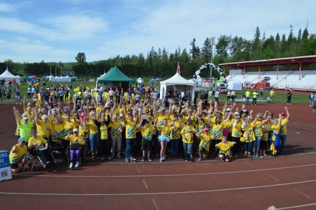 The yellow shirts, cancer survivors, prepare to start the Relay For Life at Masich Place. Photos 250News